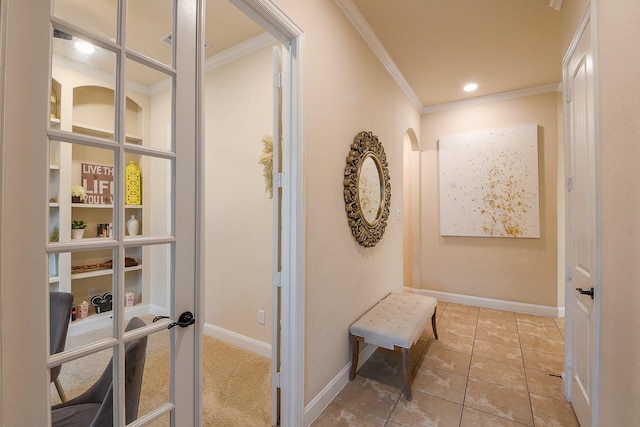 2800 Spencer Ct, Pearland, TX 77089 - hallway with ornamental molding, baseboards, light tile patterned flooring, and arched walkways