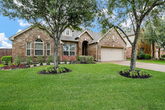2800 Spencer Ct, Pearland, TX 77089 - view of front of home with brick siding, an attached garage, and concrete driveway