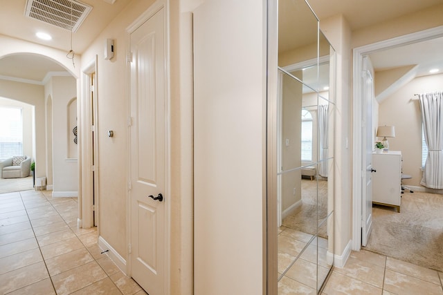 2800 Spencer Ct, Pearland, TX 77089 - corridor with light tile patterned floors, plenty of natural light, arched walkways, and crown molding