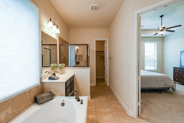2800 Spencer Ct, Pearland, TX 77089 - full bathroom featuring vanity, a bath, ceiling fan, a shower with shower door, and tile patterned floors