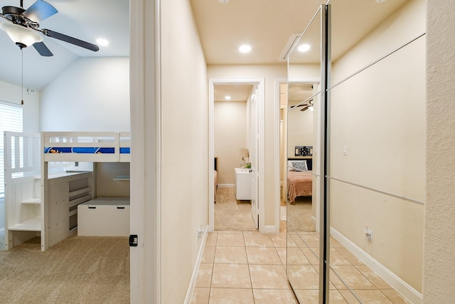 2800 Spencer Ct, Pearland, TX 77089 - hallway with light tile patterned floors, baseboards, vaulted ceiling, recessed lighting, and light colored carpet