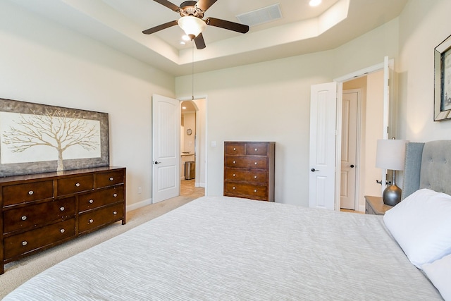 2800 Spencer Ct, Pearland, TX 77089 - bedroom with a tray ceiling, light carpet, baseboards, a high ceiling, and a ceiling fan