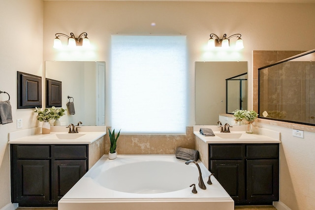 2800 Spencer Ct, Pearland, TX 77089 - bathroom featuring a garden tub, two vanities, and a tile shower