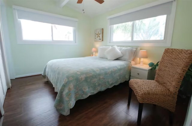 22201 Matagorda Dr, Galveston, TX 77554 - bedroom featuring multiple windows, dark wood finished floors, vaulted ceiling, baseboards, and ceiling fan