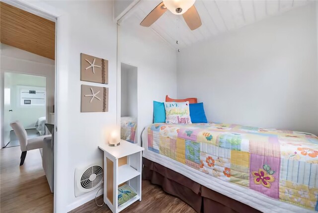22201 Matagorda Dr, Galveston, TX 77554 - bedroom with lofted ceiling, wood finished floors, and ceiling fan