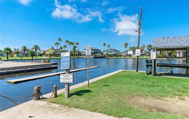 22201 Matagorda Dr, Galveston, TX 77554 - dock with a water view, a residential view, and a lawn