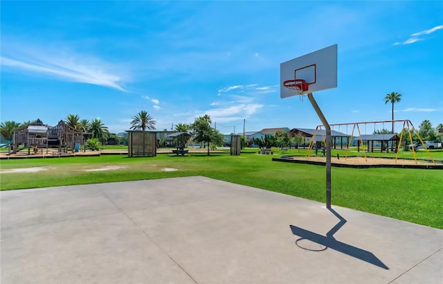 22201 Matagorda Dr, Galveston, TX 77554 - view of sport court with community basketball court and a lawn