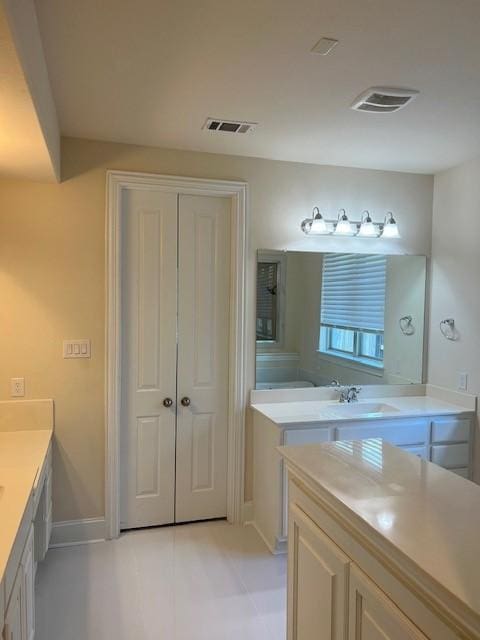 10255 S Goshawk Trl, Conroe, TX 77385 - bathroom featuring vanity, baseboards, and tile patterned flooring
