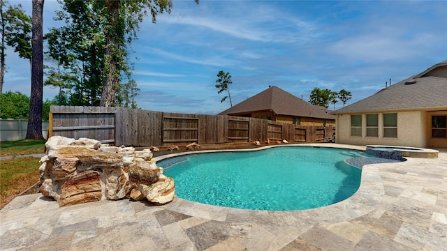 10255 S Goshawk Trl, Conroe, TX 77385 - view of swimming pool with a fenced backyard, a pool with connected hot tub, and a patio