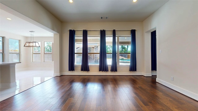 10255 S Goshawk Trl, Conroe, TX 77385 - empty room featuring a chandelier, wood finished floors, recessed lighting, and baseboards