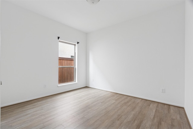 18415 Circle Bar Ranch Ct, Cypress, TX 77433 - empty room with wood finished floors and baseboards
