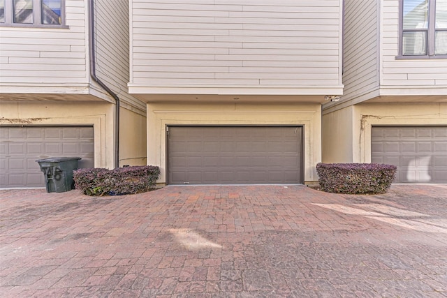 2425 Polk St, Houston, TX 77003 - garage featuring decorative driveway