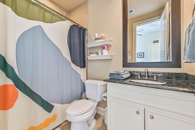 2425 Polk St, Houston, TX 77003 - bathroom with toilet, vanity, and curtained shower
