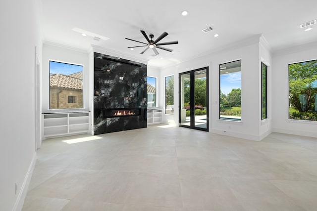 91 Lake Sterling Gate Dr, Spring, TX 77379 - unfurnished living room with ornamental molding, a high end fireplace, recessed lighting, ceiling fan, and baseboards