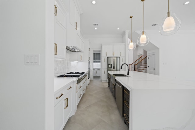 91 Lake Sterling Gate Dr, Spring, TX 77379 - kitchen with a sink, appliances with stainless steel finishes, white cabinets, recessed lighting, and light countertops
