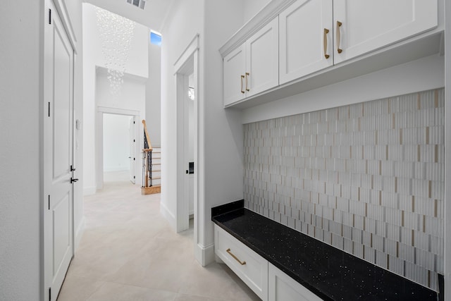 91 Lake Sterling Gate Dr, Spring, TX 77379 - mudroom with light tile patterned floors and baseboards