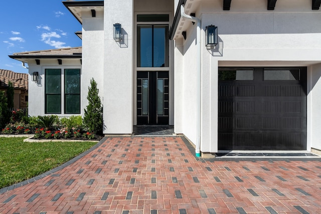 91 Lake Sterling Gate Dr, Spring, TX 77379 - entrance to property with a garage and stucco siding