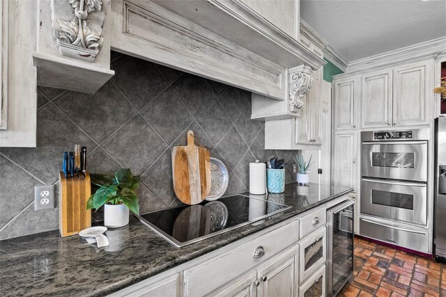 17265 Fm 2154, College Station, TX 77845 - kitchen featuring double oven, beverage cooler, a warming drawer, brick flooring, and black electric stovetop