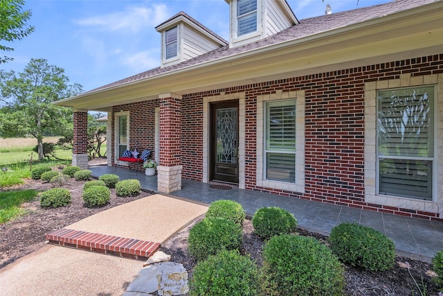 17265 Fm 2154, College Station, TX 77845 - doorway to property with brick siding and a patio area