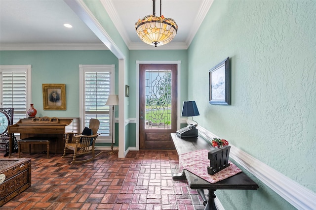 17265 Fm 2154, College Station, TX 77845 - entryway featuring brick floors, crown molding, a textured wall, and baseboards