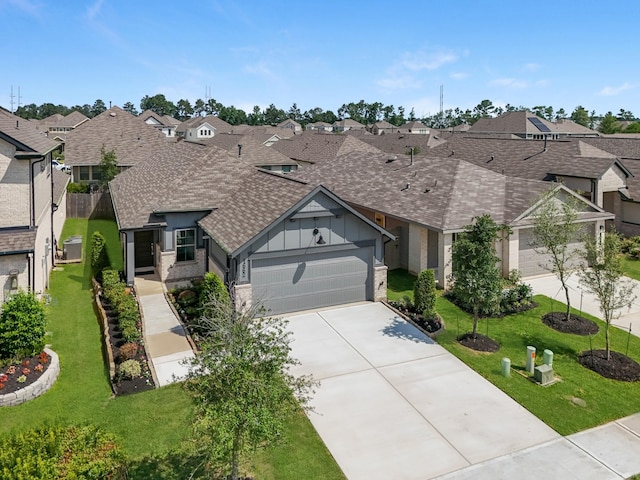 1662 Portia Ln, Conroe, TX 77301 - view of front of property featuring a residential view, roof with shingles, an attached garage, board and batten siding, and concrete driveway