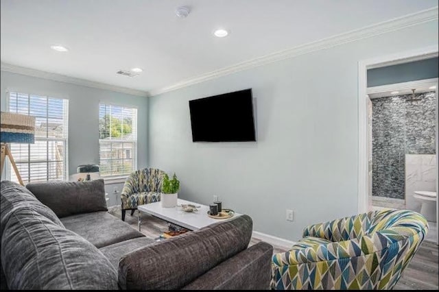 1513 47th St, Galveston, TX 77551 - living room featuring recessed lighting, crown molding, baseboards, and wood finished floors
