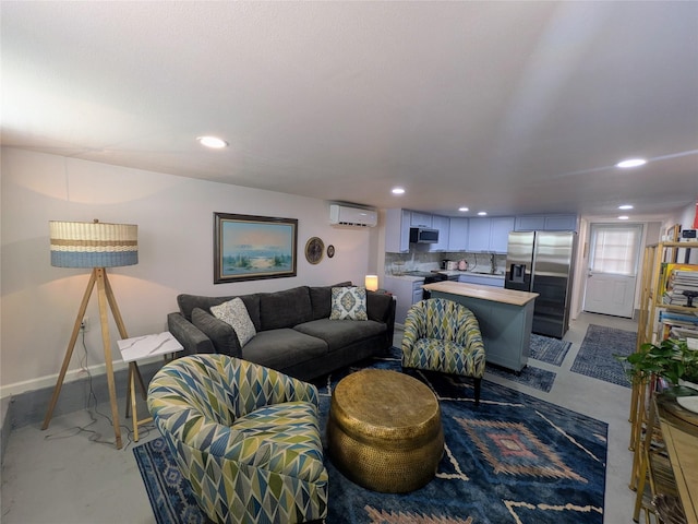1513 47th St, Galveston, TX 77551 - living area featuring concrete flooring, a wall unit AC, recessed lighting, and baseboards