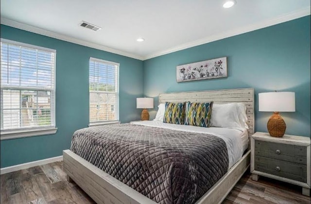 1513 47th St, Galveston, TX 77551 - bedroom featuring baseboards, wood finished floors, crown molding, and recessed lighting