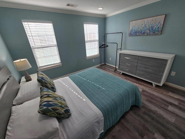 1513 47th St, Galveston, TX 77551 - bedroom featuring baseboards, dark wood-type flooring, and ornamental molding