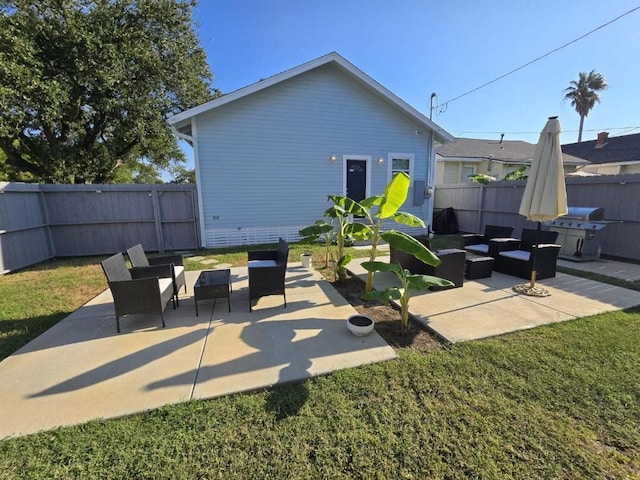 1513 47th St, Galveston, TX 77551 - fenced backyard featuring an outdoor living space, a patio, and a grill