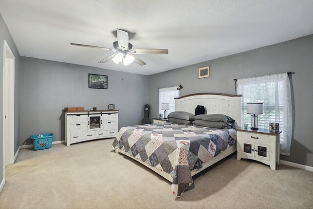 12222 23rd St, Santa Fe, TX 77510 - bedroom with carpet flooring, baseboards, and a ceiling fan