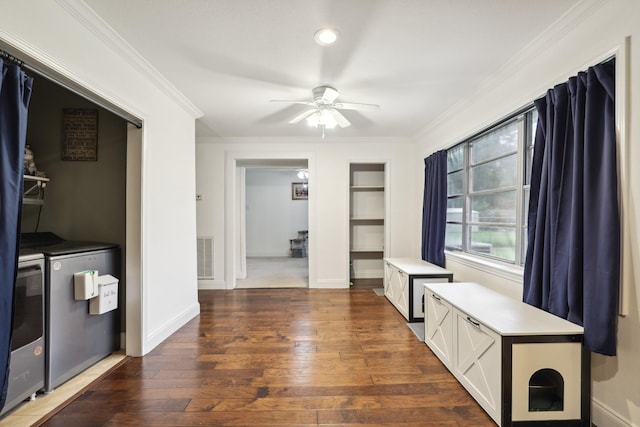 12222 23rd St, Santa Fe, TX 77510 - hall with washing machine and dryer, crown molding, hardwood / wood-style flooring, built in shelves, and baseboards