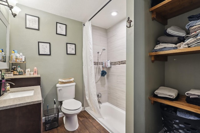 12222 23rd St, Santa Fe, TX 77510 - bathroom with vanity, toilet, wood finished floors, shower / bath combo, and recessed lighting