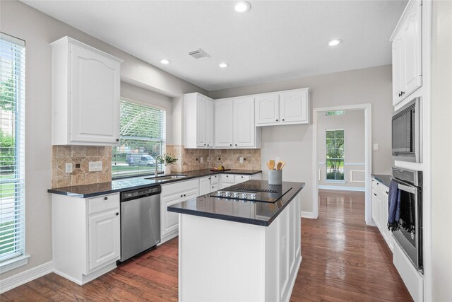 19203 Allview Ln, Houston, TX 77094 - kitchen featuring black appliances, dark wood-type flooring, a sink, white cabinets, and dark countertops