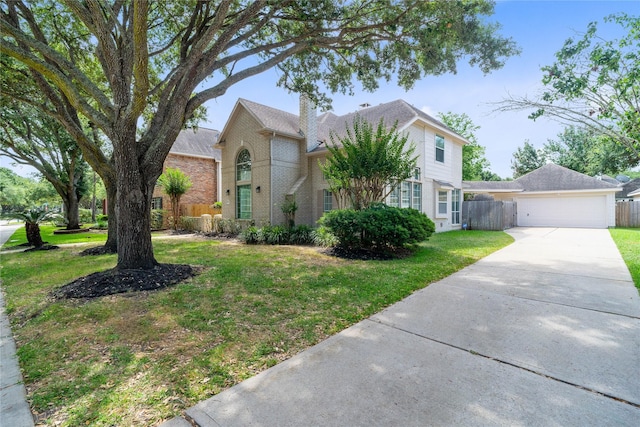 19203 Allview Ln, Houston, TX 77094 - traditional-style house with driveway, brick siding, an attached garage, and a chimney