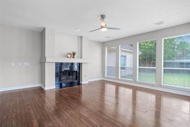 19203 Allview Ln, Houston, TX 77094 - unfurnished living room with wood finished floors, a tiled fireplace, baseboards, and ceiling fan