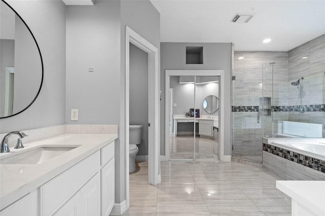 19203 Allview Ln, Houston, TX 77094 - full bathroom featuring a stall shower, vanity, toilet, a garden tub, and baseboards
