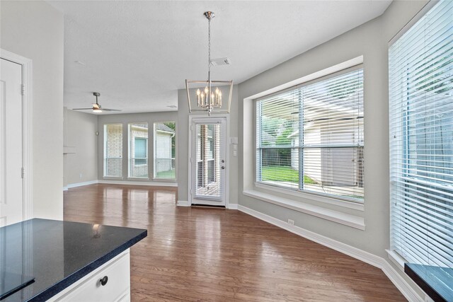 19203 Allview Ln, Houston, TX 77094 - unfurnished dining area with dark wood-type flooring, a chandelier, baseboards, and a ceiling fan