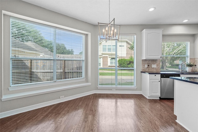 19203 Allview Ln, Houston, TX 77094 - kitchen featuring stainless steel dishwasher, dark countertops, a chandelier, white cabinets, and a sink