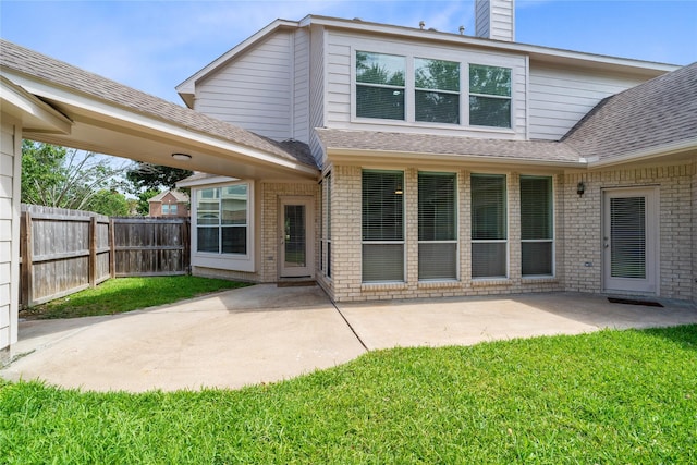 19203 Allview Ln, Houston, TX 77094 - rear view of house with brick siding, a chimney, a patio area, and roof with shingles