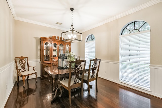 40319 Three Forks Rd, Magnolia, TX 77354 - dining area with a chandelier, a wainscoted wall, dark wood-type flooring, and crown molding