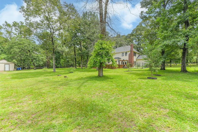 40319 Three Forks Rd, Magnolia, TX 77354 - view of yard featuring an outbuilding