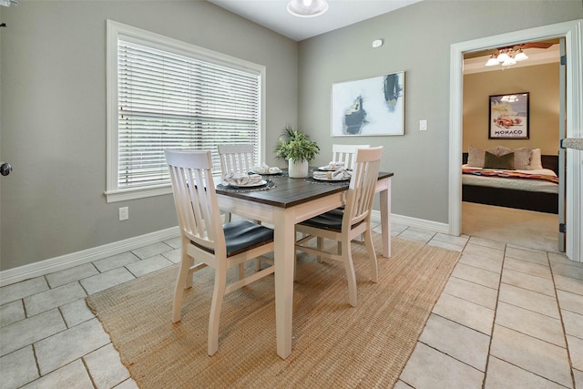 2707 Colony Creek Dr, Bryan, TX 77808 - dining area featuring light tile patterned floors and baseboards