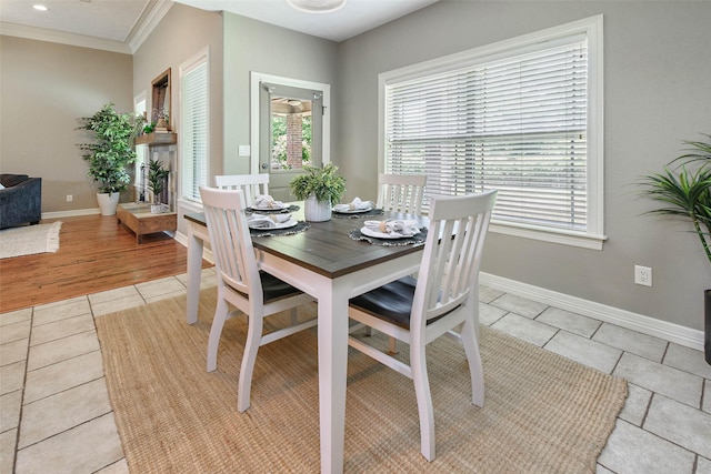 2707 Colony Creek Dr, Bryan, TX 77808 - dining room with light tile patterned floors, baseboards, and crown molding