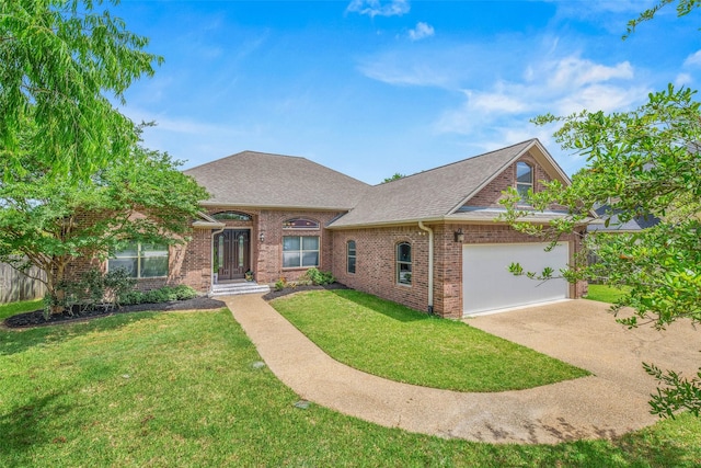 2707 Colony Creek Dr, Bryan, TX 77808 - view of front of house featuring roof with shingles, brick siding, a garage, a front yard, and driveway