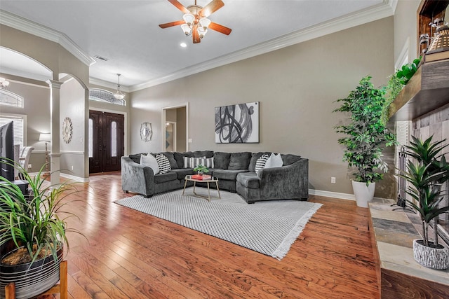 2707 Colony Creek Dr, Bryan, TX 77808 - living room with hardwood / wood-style flooring, baseboards, a ceiling fan, ornamental molding, and ornate columns