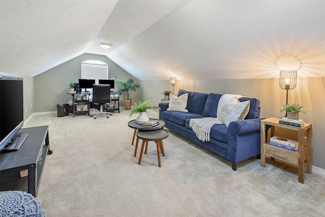 2707 Colony Creek Dr, Bryan, TX 77808 - carpeted living room featuring an office area, vaulted ceiling, and baseboards