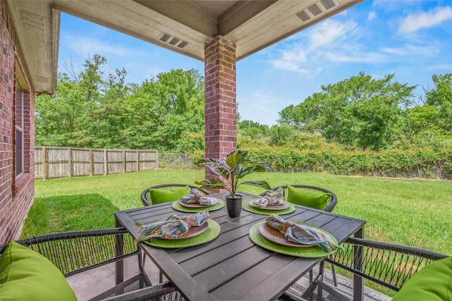 2707 Colony Creek Dr, Bryan, TX 77808 - view of patio / terrace with view of wooded area and outdoor dining space
