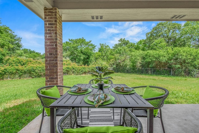 2707 Colony Creek Dr, Bryan, TX 77808 - view of patio / terrace with outdoor dining space and view of wooded area