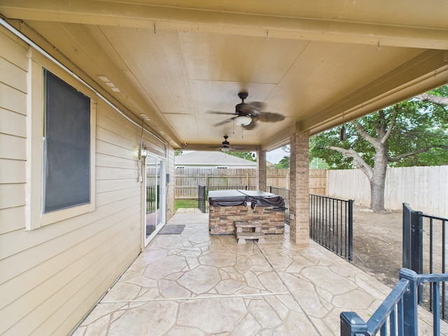1035 Turnberry Park Ln, Spring, TX 77373 - fenced backyard with a patio area, ceiling fan, and a hot tub